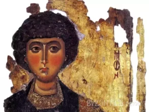 Detail of Saint Panteleimon icon in Megisti Lavra showing facial features against gold background, 12th-century Byzantine art